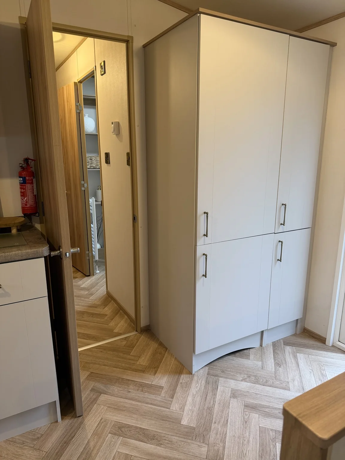 Full height fitted storage cupboards in the caravan