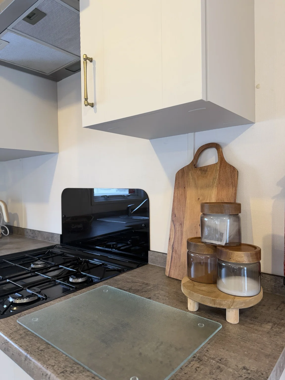 Gas hob, storage jars and wooden board