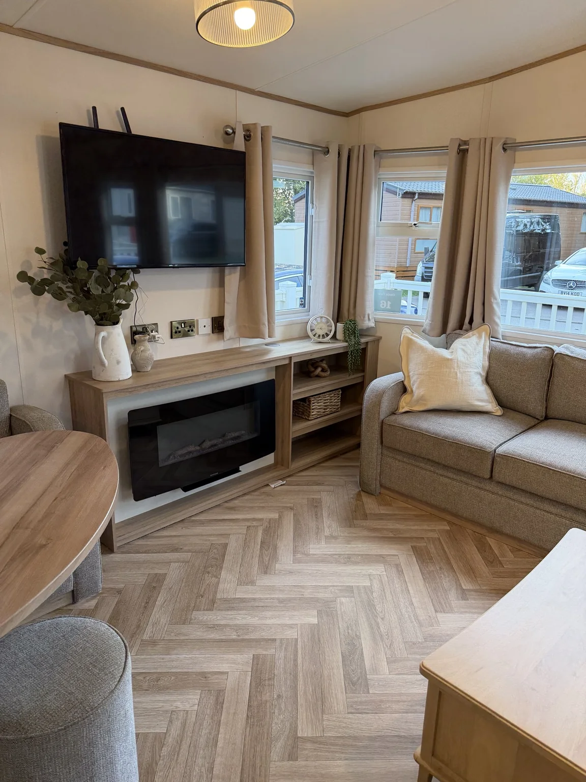 Lounge with television, fireplace and seating area
