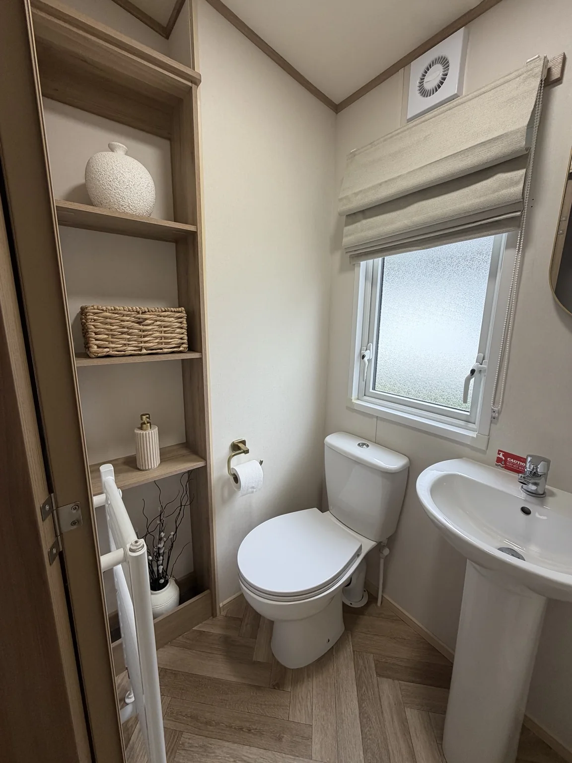 WC and hand basin with open shelving